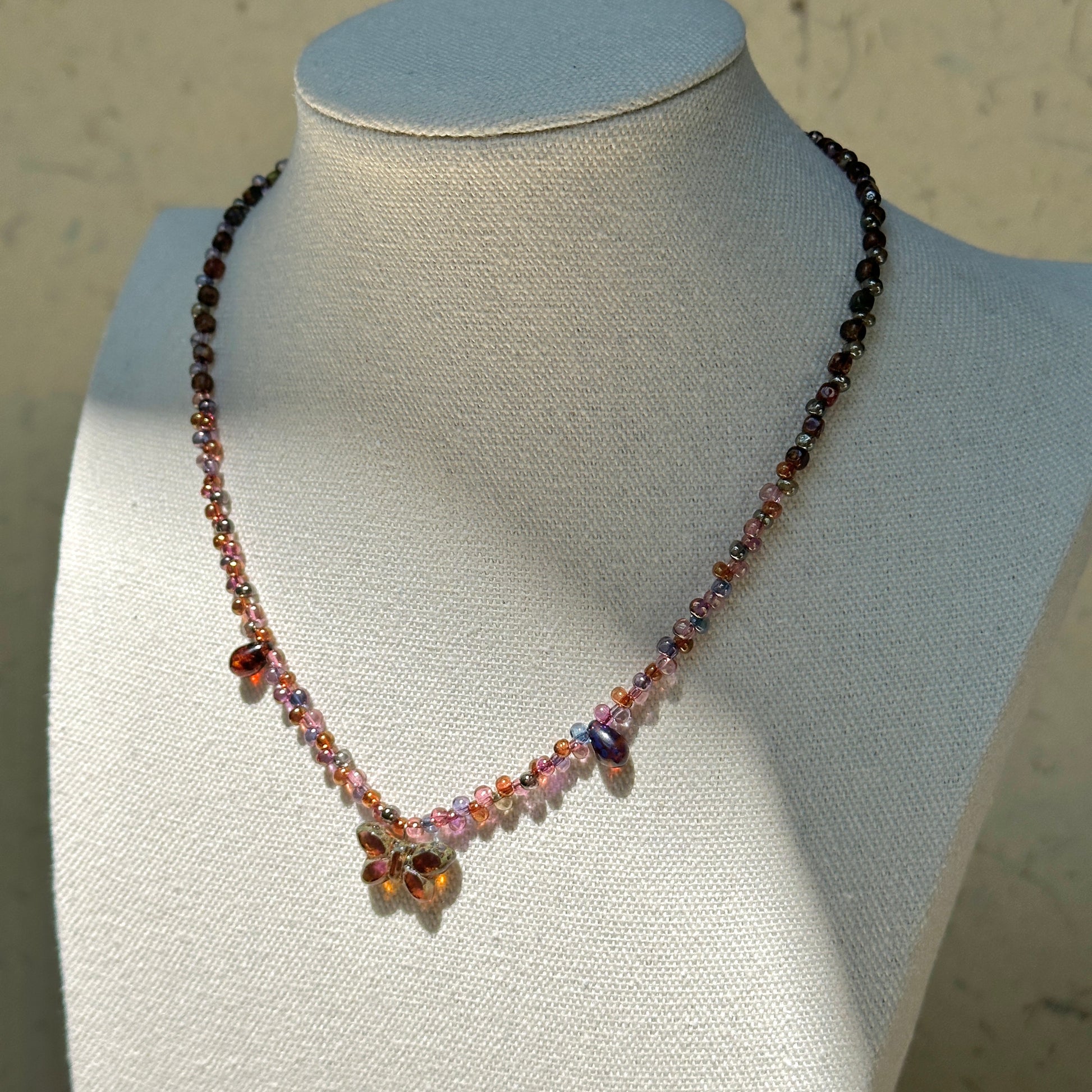 Twilight Bloom Necklace worn on model – romantic beaded necklace with wine-red and plum tones, handcrafted by Glazenya.