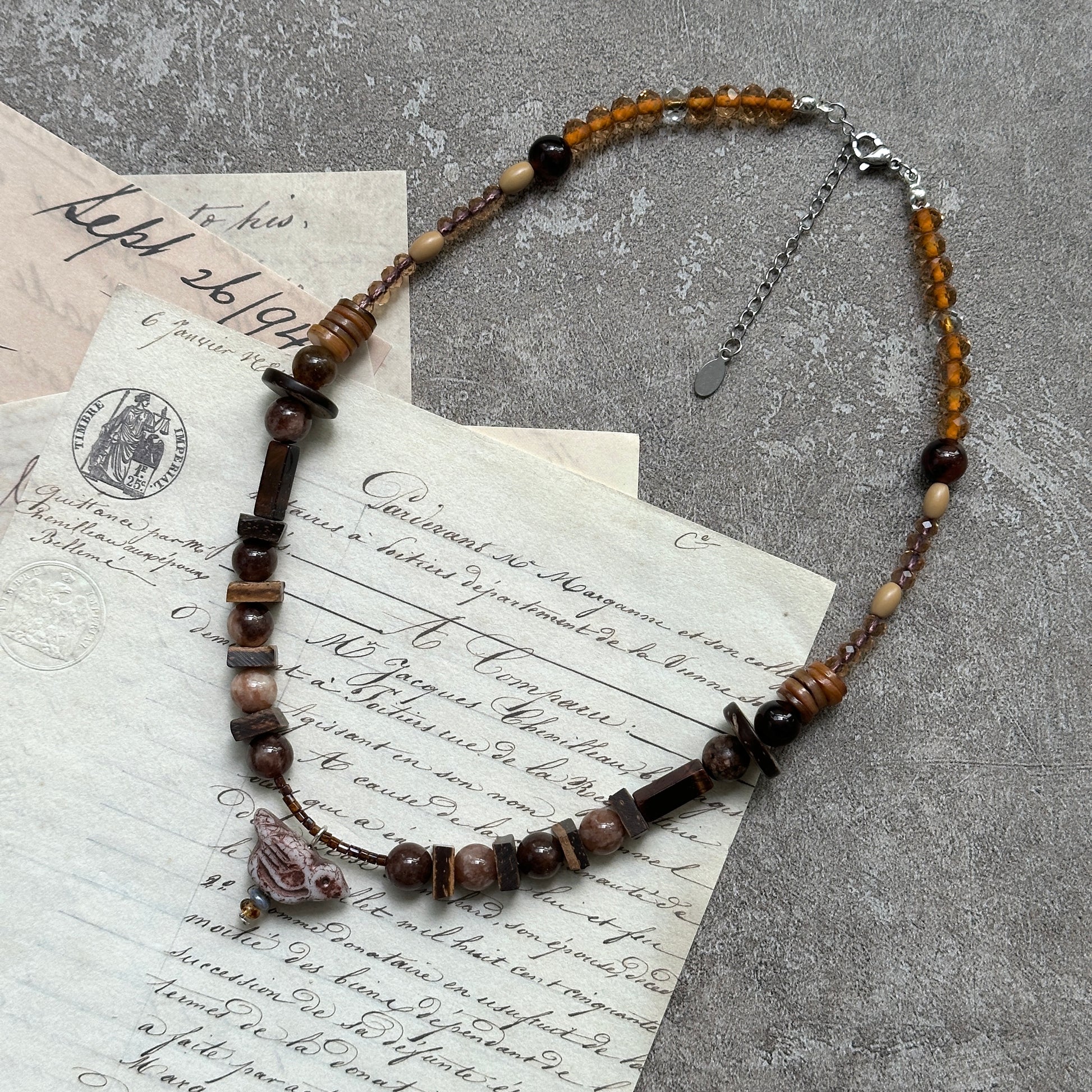 Earthy mix of mocha, amber and marbled beads, lightweight strand