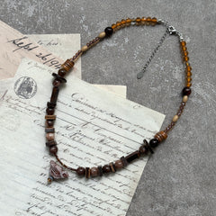 Earthy mix of mocha, amber and marbled beads, lightweight strand