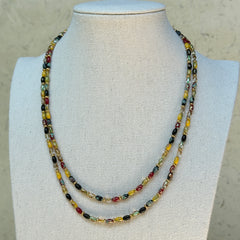 Tribal Glow Necklace worn on bust, highlighting layered strands of multicolor beads in tribal-inspired design