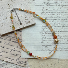 Collar de brasas doradas 