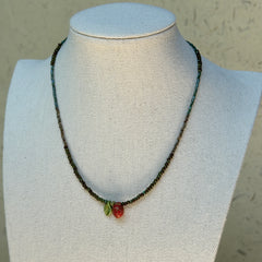 Model wearing Wild Strawberry Charm Necklace, playful summer look