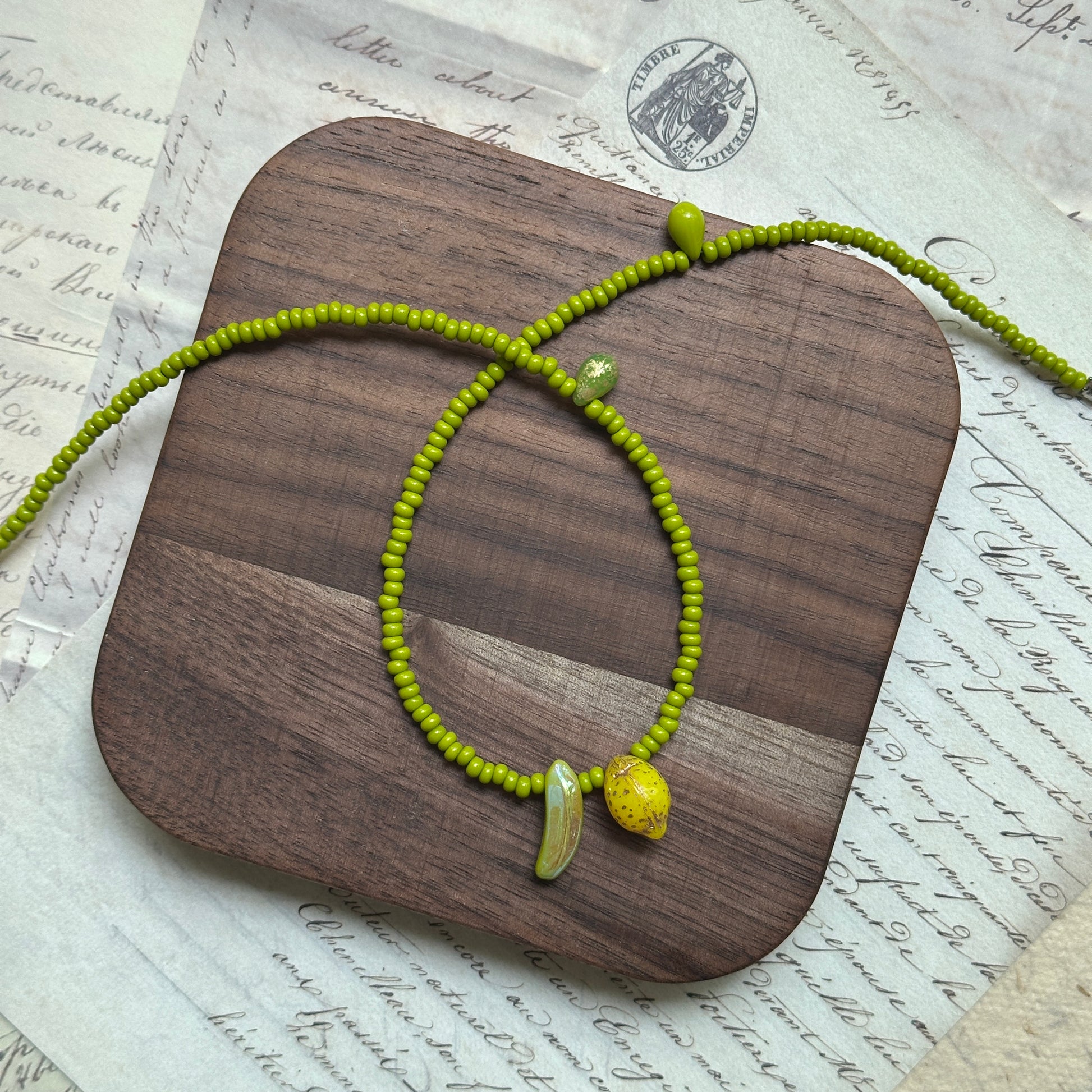 Lime-green seed bead strand with tiny heart accent, handmade