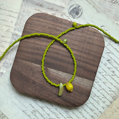 Lime-green seed bead strand with tiny heart accent, handmade