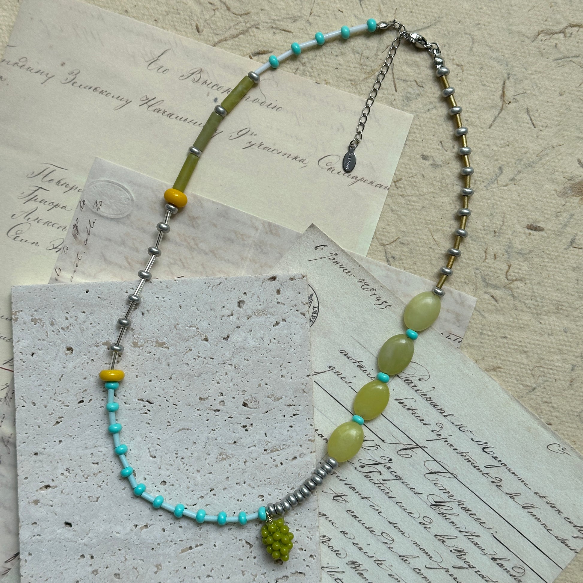 Rustic Vineyard Dream Necklace with mixed glass beads and grape-inspired pendant, handcrafted in olive, turquoise, and golden tones.