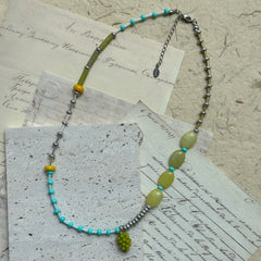 Rustic Vineyard Dream Necklace with mixed glass beads and grape-inspired pendant, handcrafted in olive, turquoise, and golden tones.