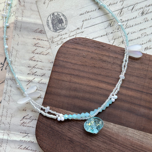 Handmade necklace with aqua scallop seashell pendant and icy-blue glass beads – Glazenya