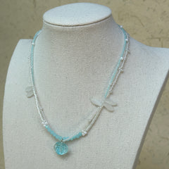 Model wearing Aqua Scallop Charm Necklace, beachy everyday style