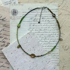Verdant Leaf Necklace with green gradient glass beads and amber centerpiece – handcrafted artisan jewelry by Glazenya

