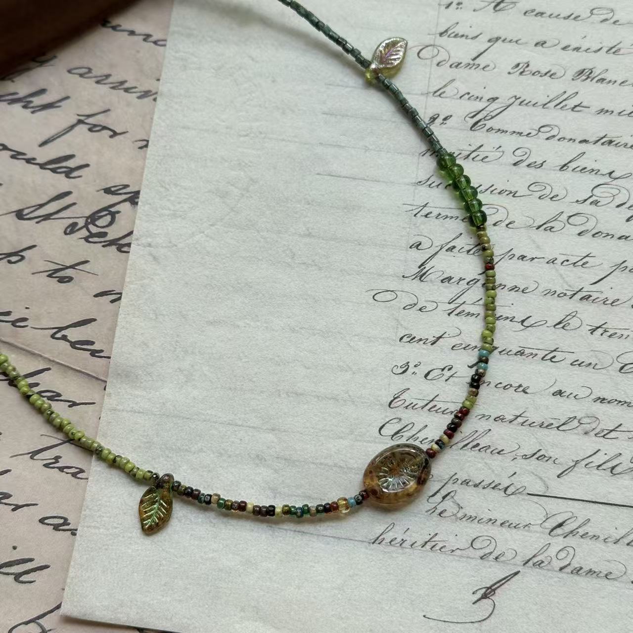 Glazenya Verdant Leaf Necklace in green tones with amber and crystal accents – handcrafted woodland-inspired jewelry
