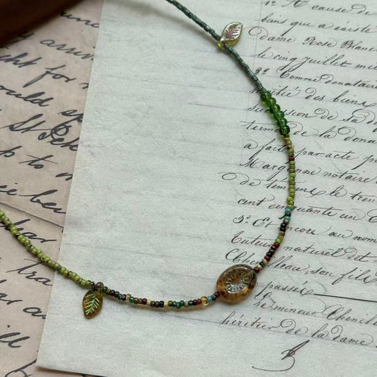 Glazenya Verdant Leaf Necklace in green tones with amber and crystal accents – handcrafted woodland-inspired jewelry
