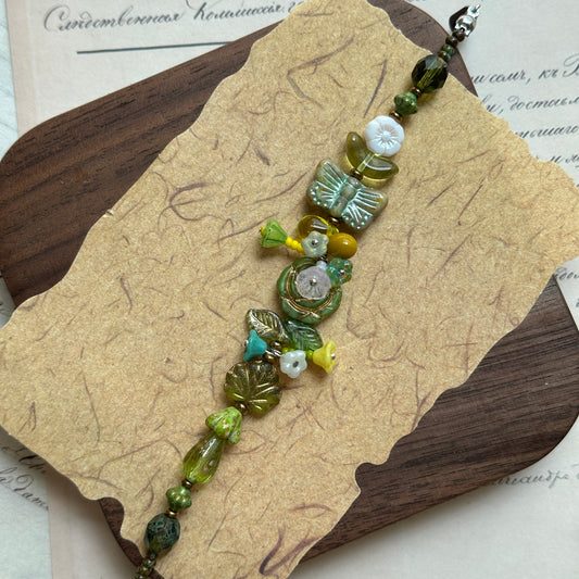 Forest Butterfly Whisper Bracelet with green butterfly charm and floral beads