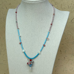 Necklace on mannequin bust, lightweight two-tone seed beads with charming flower cluster pendant