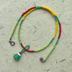 Handmade strand in green, lime and yellow seed beads, playful detail