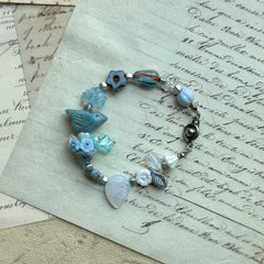 Bluebird Morning Song Bracelet with bird, floral, and leaf beads