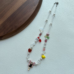 Strawberry glass beads with leaf accents on handcrafted necklace