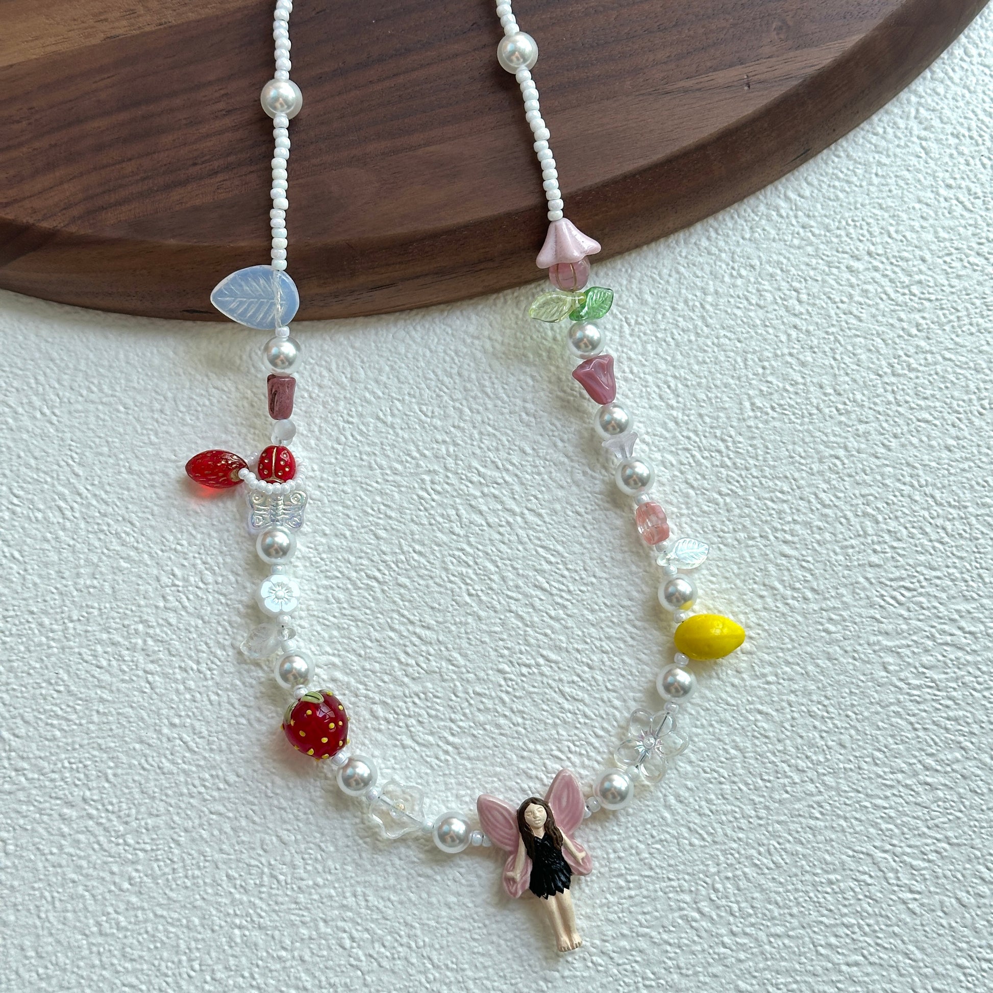 Flower and leaf glass charms with silver beads on Fairy Garden Necklace