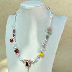 Full view of Fairy Garden Necklace displayed on beige jewelry stand