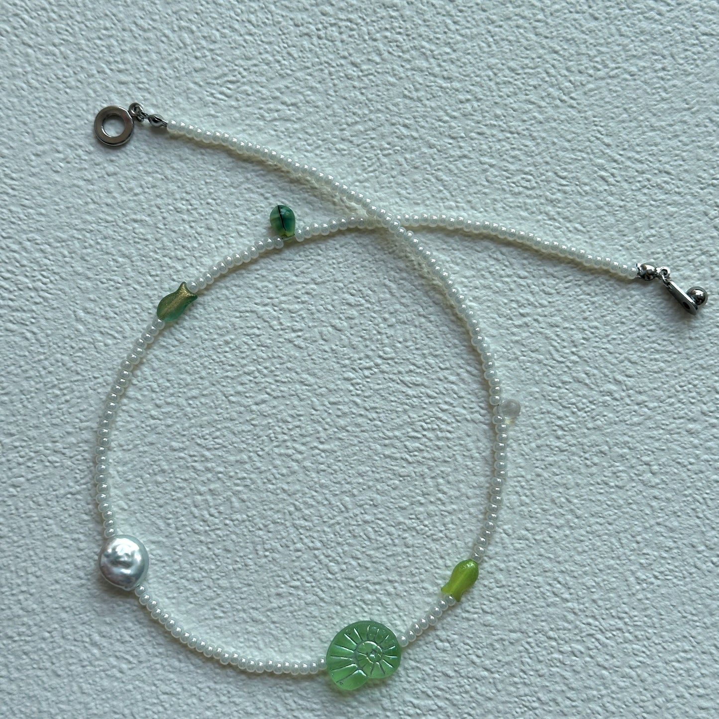 Silver pearl-like bead detail in Lily Pond Necklace