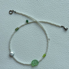 Silver pearl-like bead detail in Lily Pond Necklace