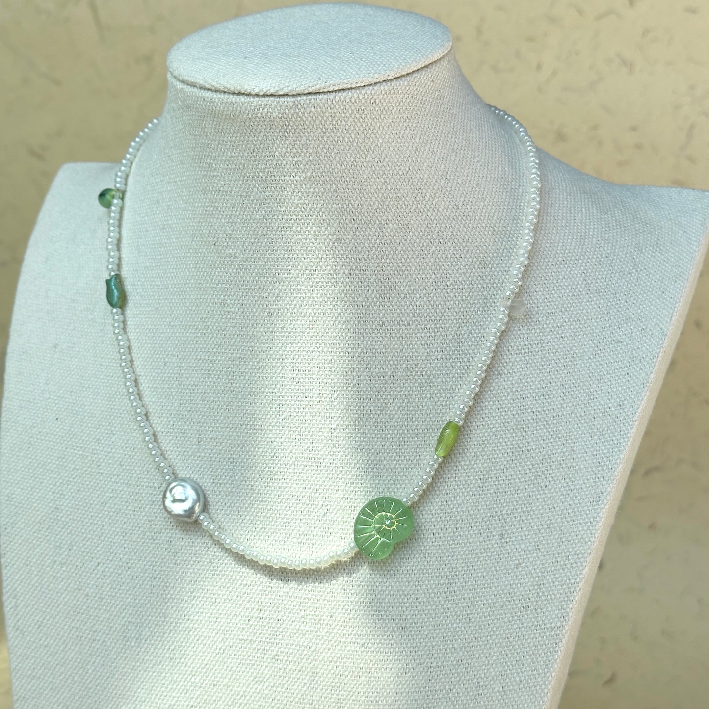 Green glass accent beads with handcrafted seed bead strand