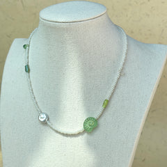Green glass accent beads with handcrafted seed bead strand