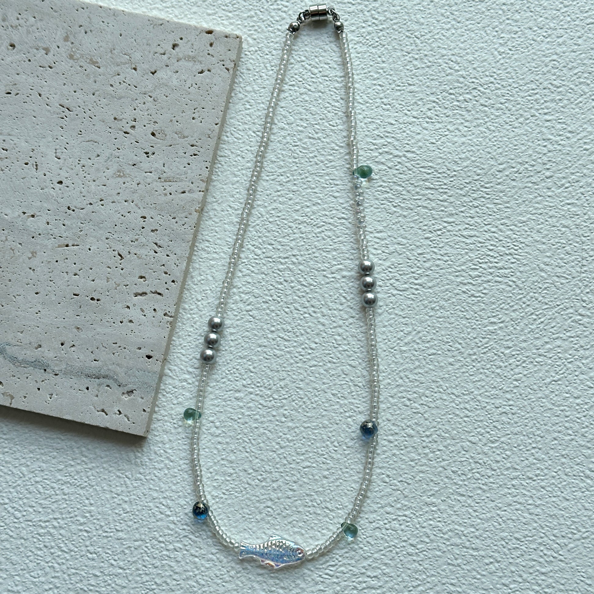 Silver round beads with aqua glass accents on handcrafted necklace