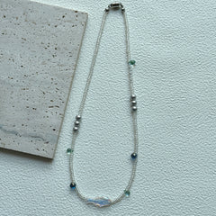 Silver round beads with aqua glass accents on handcrafted necklace