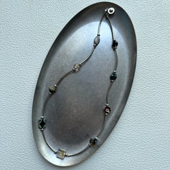 Amber and moss green bead details in handcrafted Vintage Path Necklace