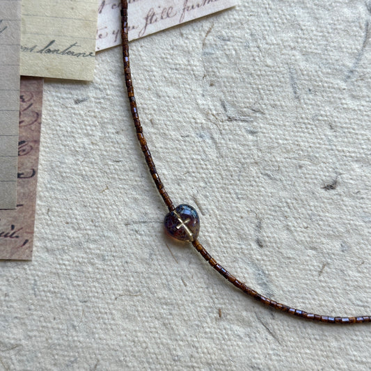 Rustic Butterfly Necklace with turquoise butterfly bead on display bust