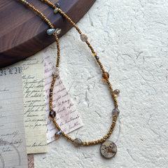 Smoky glass accent bead detail on Cancer Relic Necklace