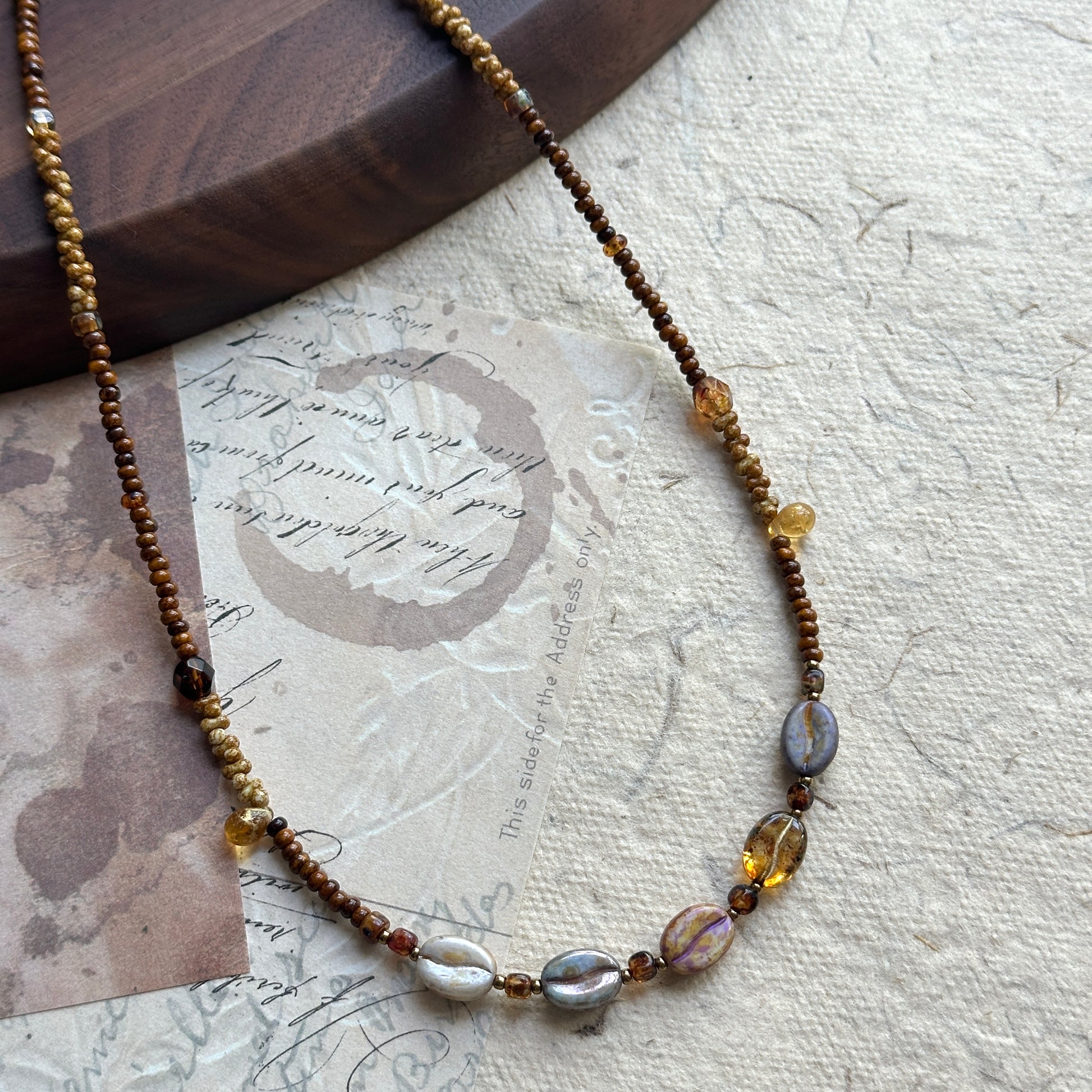 Close-up of iridescent center beads in Sunset Relic Necklace
