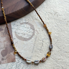 Close-up of iridescent center beads in Sunset Relic Necklace