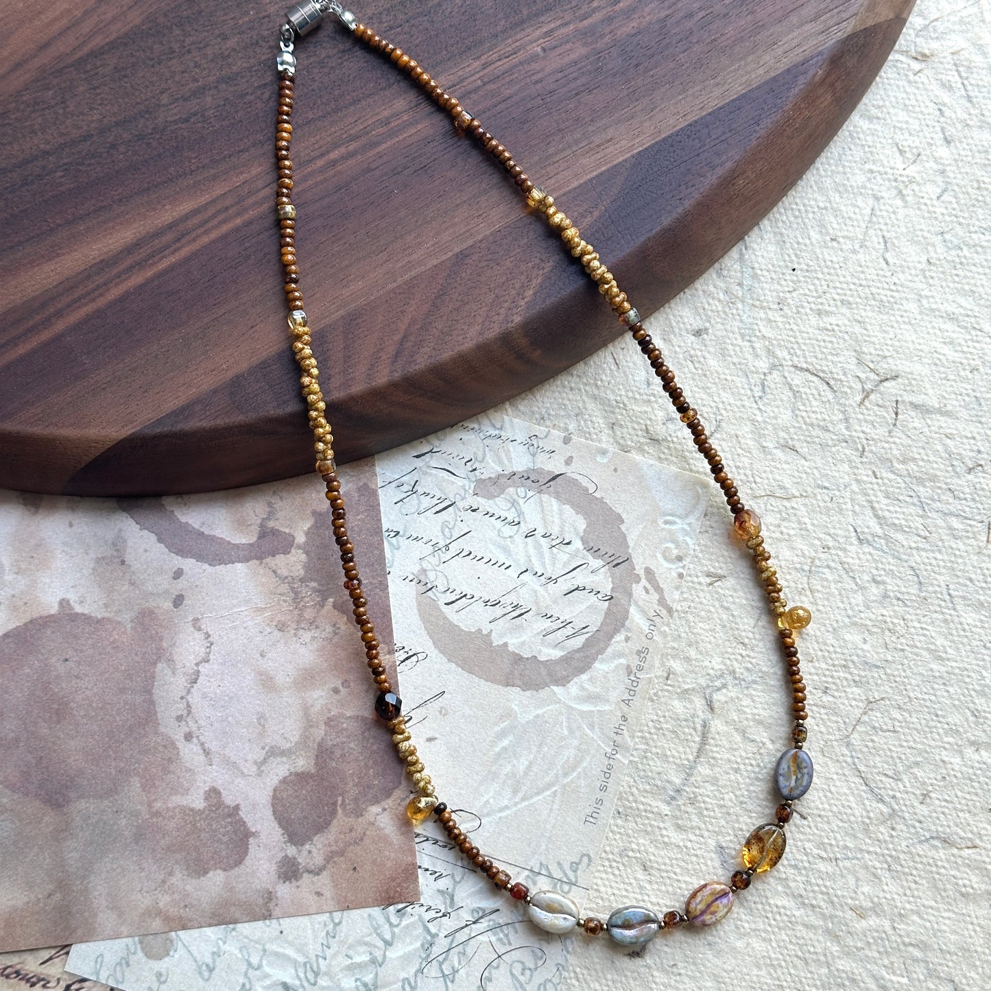 Brown seed beads accented with warm amber tones