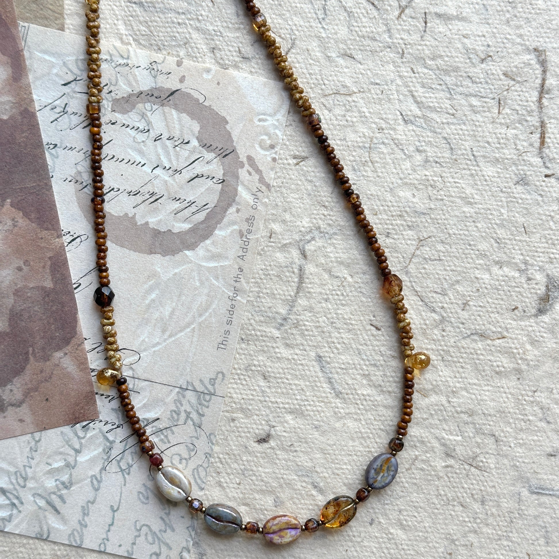 Rustic handcrafted necklace with earthy and sunset-inspired colors