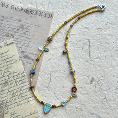 Floral and leaf-shaped bead details in Meadow Leaf Necklace