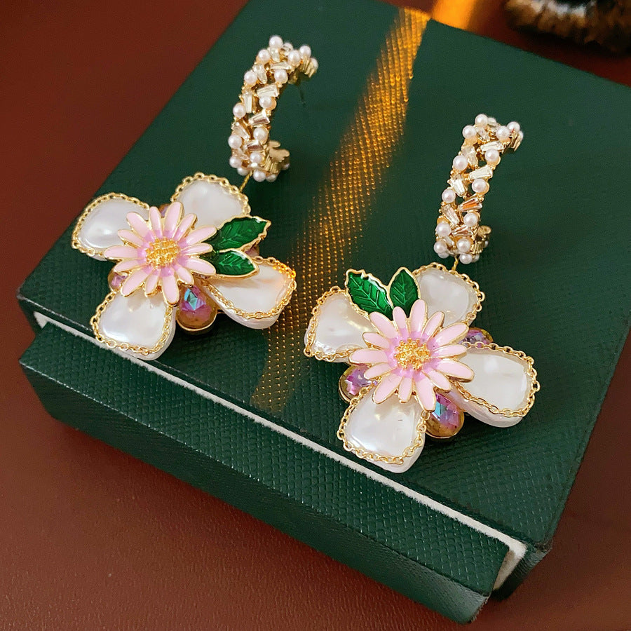 Romantic floral statement earrings with pink blossoms, imitation pearls, and enamel petals — Blossom Pearl Garden Earrings.