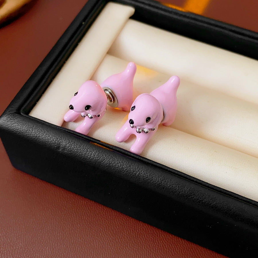 Glossy 3D puppy stud earrings in silver, pink, and coffee on post backs — Playful Pup Stud Earrings.