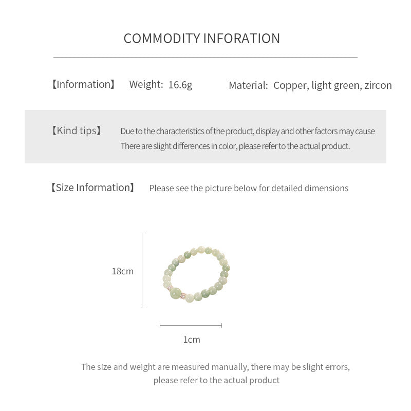 A fresh light green round bead bracelet with two silver zircon spacer beads and a large main bead - Celadon Serenity Bracelet.