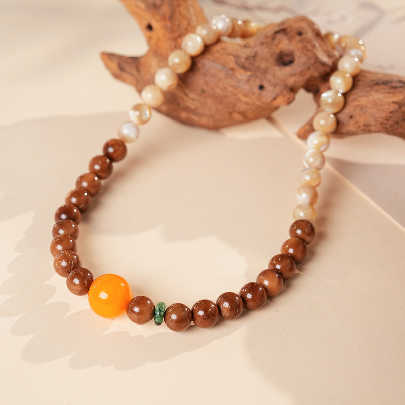 Dual-strand natural stone bracelet with amber centerpiece and shell beads in warm brown and beige tones – Glazenya light luxury jewelry