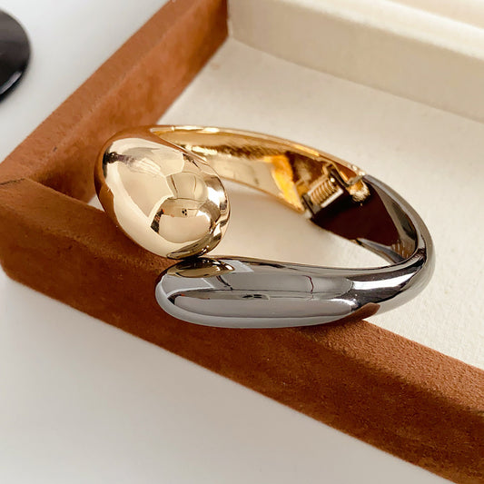 Fluid Fusion Duo Bangle in Gold and Silver – sculptural hinged design, high-gloss finish – Glazenya