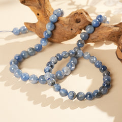 Blue crystal beaded bracelet with gold-tone spacers, shown in 6 mm and 8 mm options — Indigo Mist Crystal Bracelet by Glazenya.