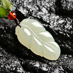 Hetian (nephrite) white jade leaf pendant close-up – Golden Bough, 38×21×8 mm