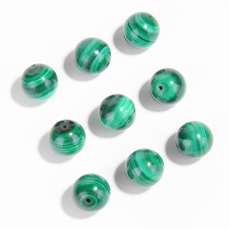 Malachite round beads with green banded “peacock” patterns, polished, assorted 4–12 mm — Peacock Veins.