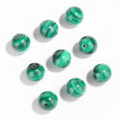 Malachite round beads with green banded “peacock” patterns, polished, assorted 4–12 mm — Peacock Veins.