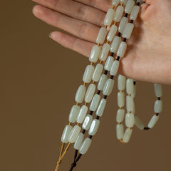 Handcrafted pendant cords wrapped with natural Hetian jade tube beads in light and dark brown — Snowglow Hetian Jade Pendant Cord.
