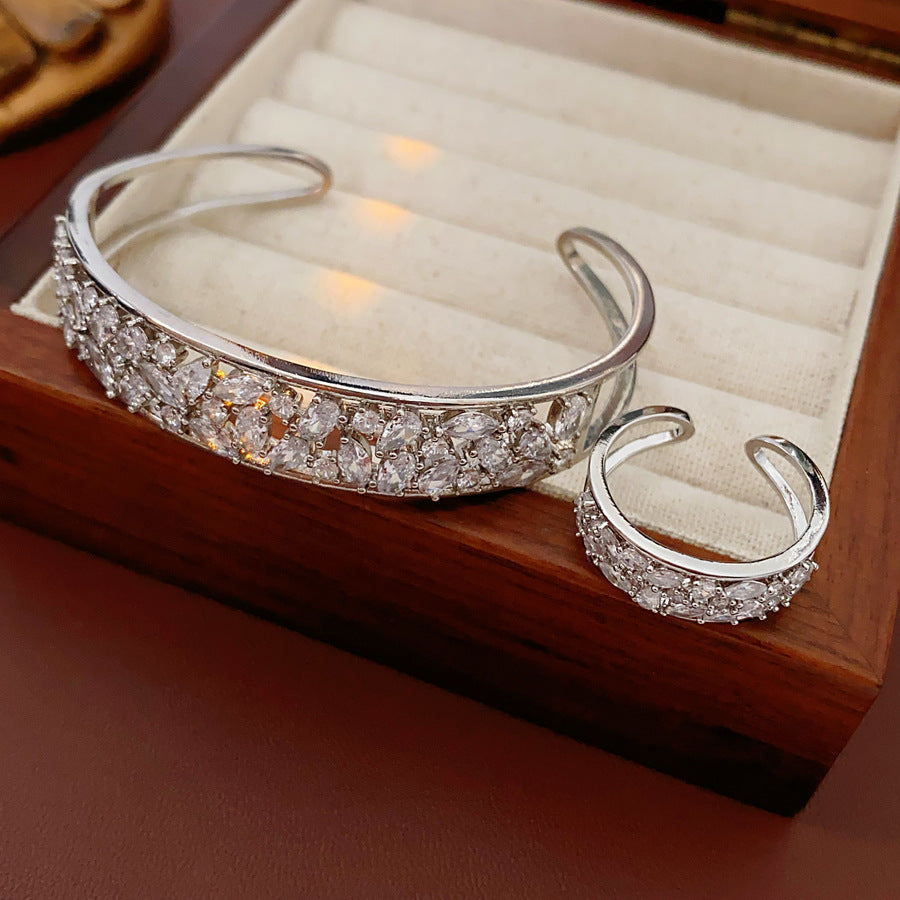 Gold and silver open cuff bracelet with matching pavé ring, set with sparkling zircons — Starlight Pavé Cuff Set by Glazenya.