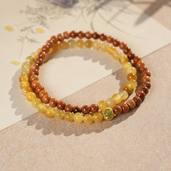 Double-strand yellow and brown beaded wrap bracelet with a small green bezel accent — Golden Harvest Wrap Bracelet Set by Glazenya.