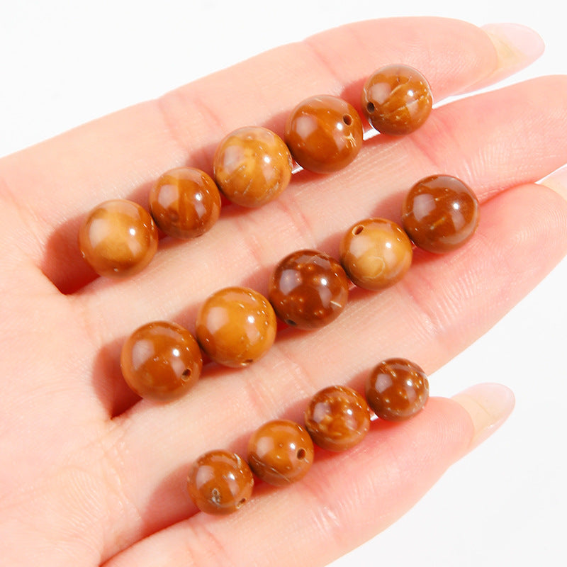 Natural Cook wood beads, amber-tone grain, polished, assorted 4–10 mm — Ambergrain Warmth.