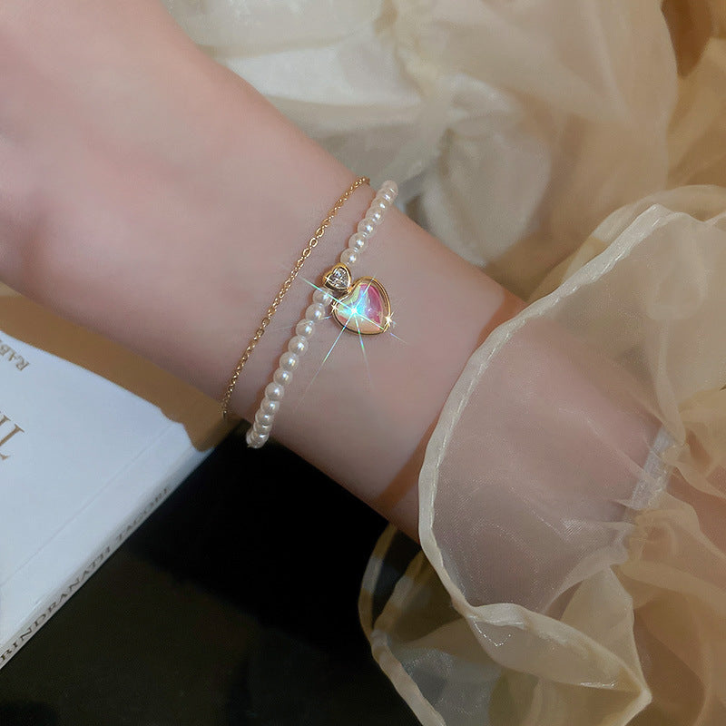 Gold-plated bracelet collection with pearls, cat’s eye stones, and floral motifs